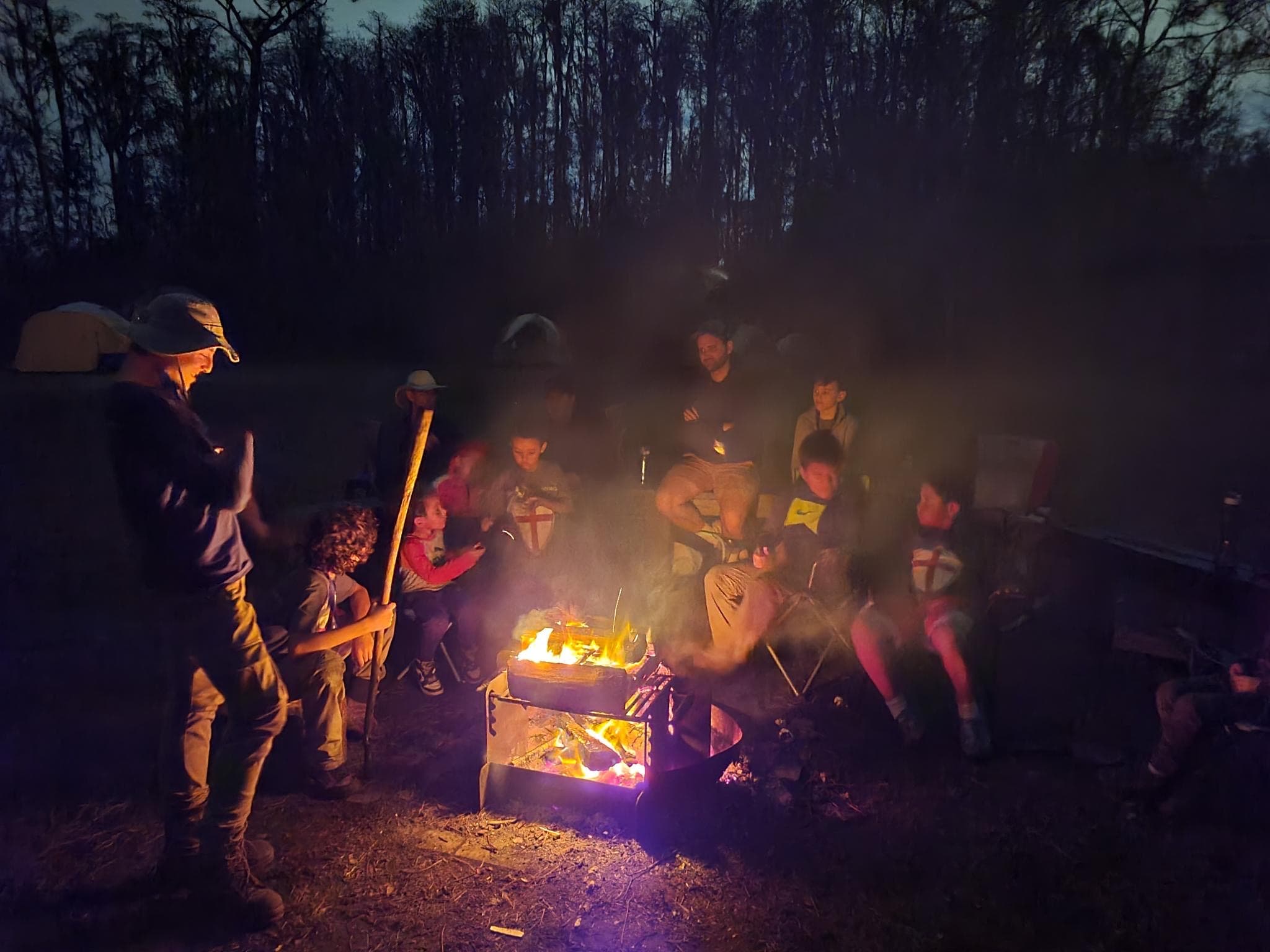 Troop 51 gathered around the fire at dusk