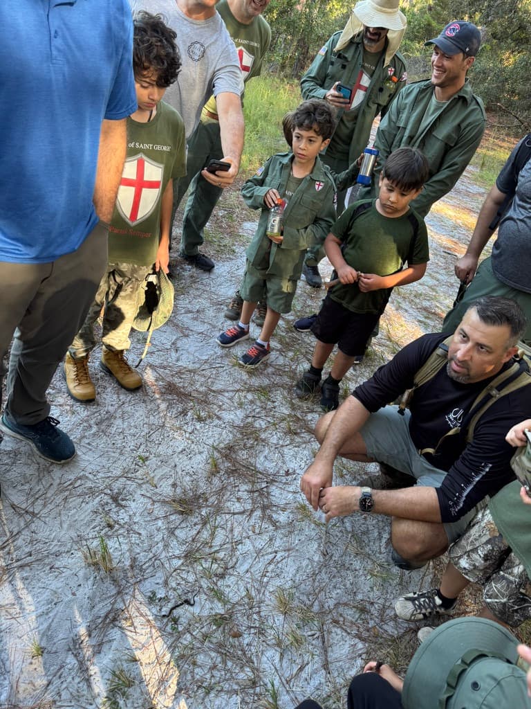 Fathers and boys gathered on the trail